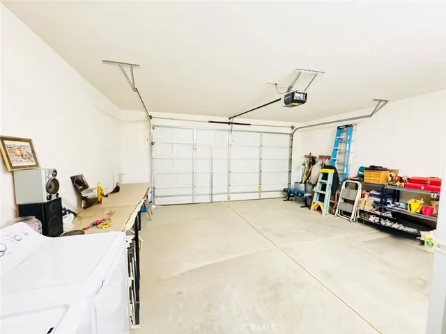 a view of a garage with rack and bicycle