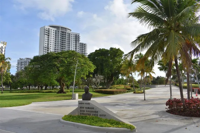 a view of a park with large trees
