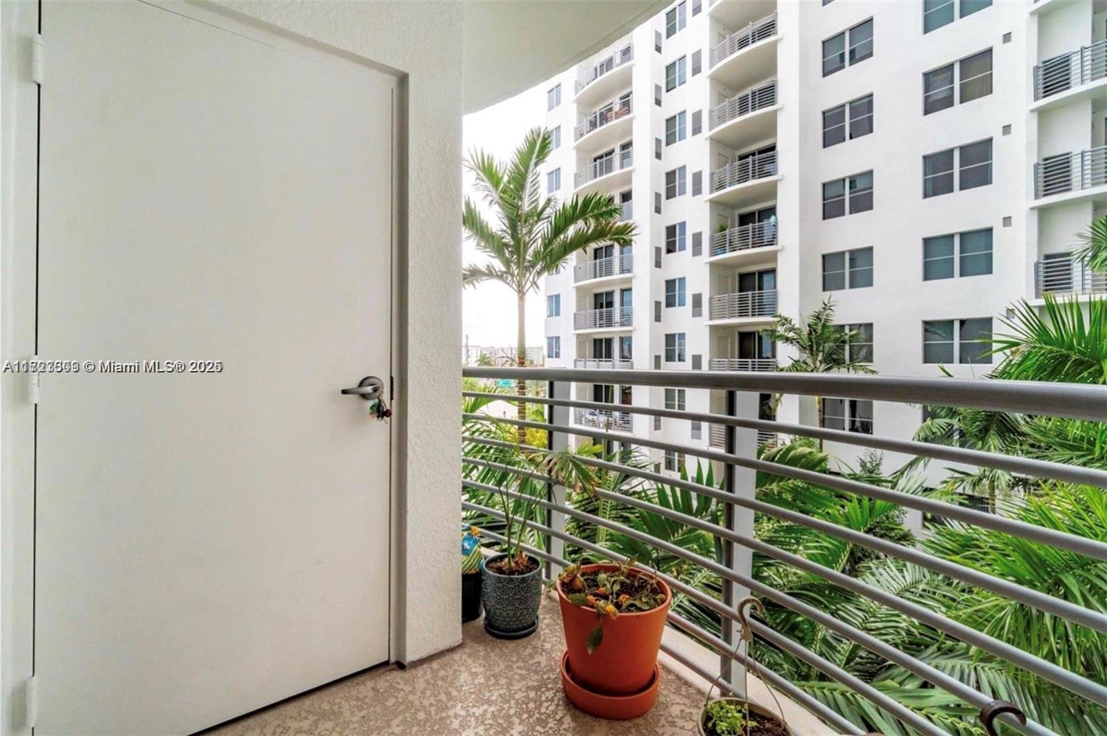 1830 Radius Drive, Unit 516 Hollywood, FL 33020 - Photo 25 of 28 a view of a building from a balcony