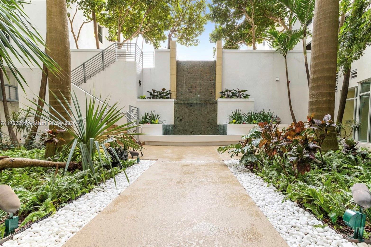 1830 Radius Drive, Unit 516 Hollywood, FL 33020 - Photo 4 of 28 a view of potted plant in front of a building