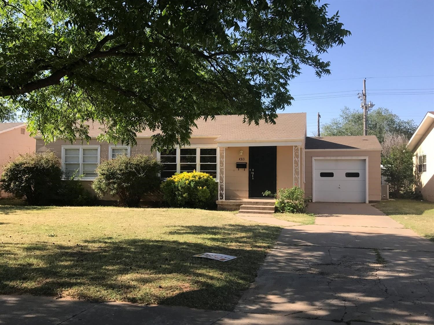 4313 31st Street Lubbock, TX 79410 - Photo 1 of 1 a view of a house with a swimming pool