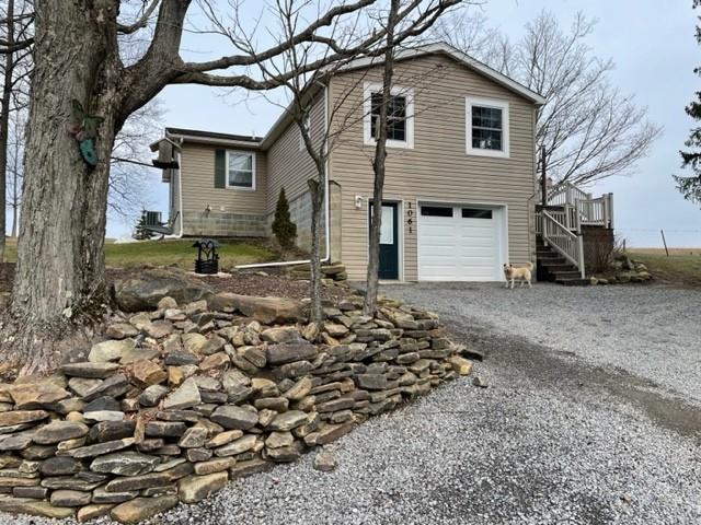 1054 Eakin Road Emlenton, PA 16373 - Photo 3 of 15 a front view of a house with a yard