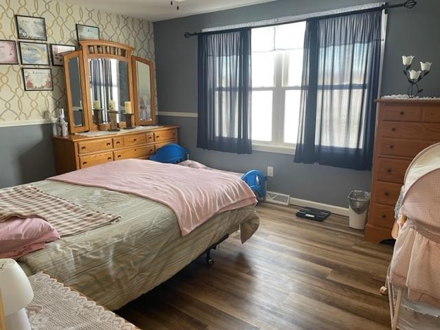 1054 Eakin Road Emlenton, PA 16373 - Photo 6 of 15 a bedroom with a bed and wooden floor