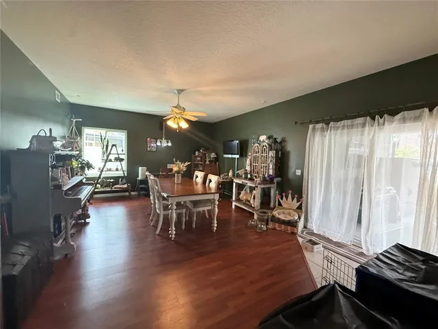 a view of a dining room with furniture and window