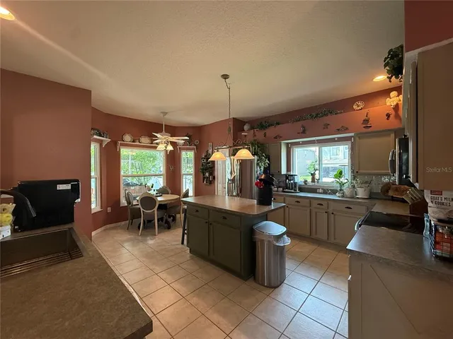a large kitchen island in the center