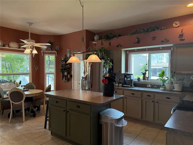 a kitchen with sink and cabinets