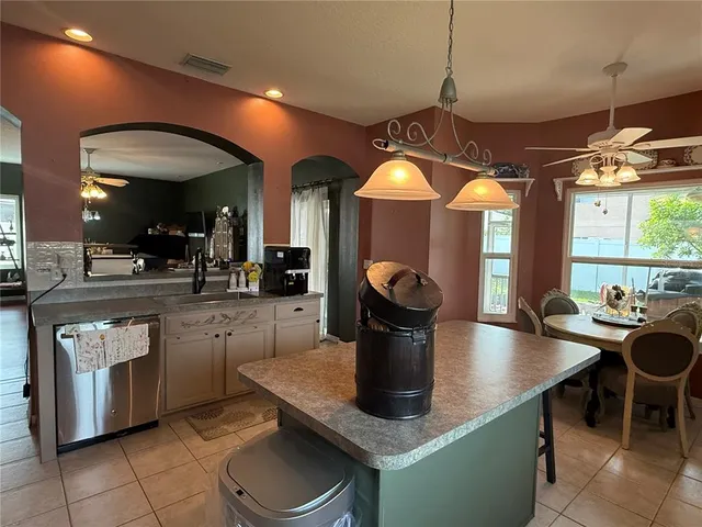 a kitchen with a sink and a refrigerator