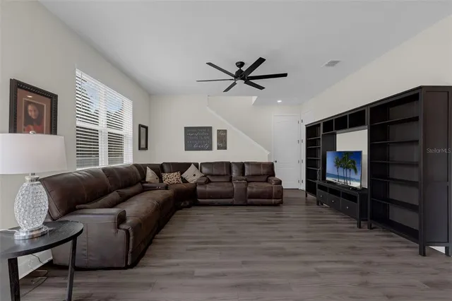 a living room with furniture or couch and a flat screen tv