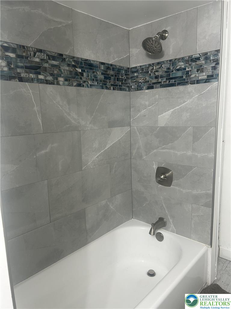 816 North Shell Street Allentown, PA 18109 - Photo 11 of 22 a bathroom with a bathtub and a shower