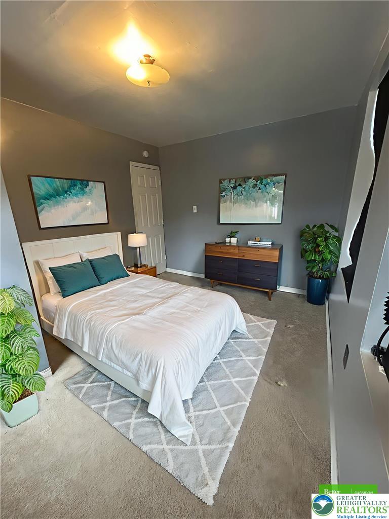 816 North Shell Street Allentown, PA 18109 - Photo 14 of 22 a bedroom with a bed and a painting on the wall