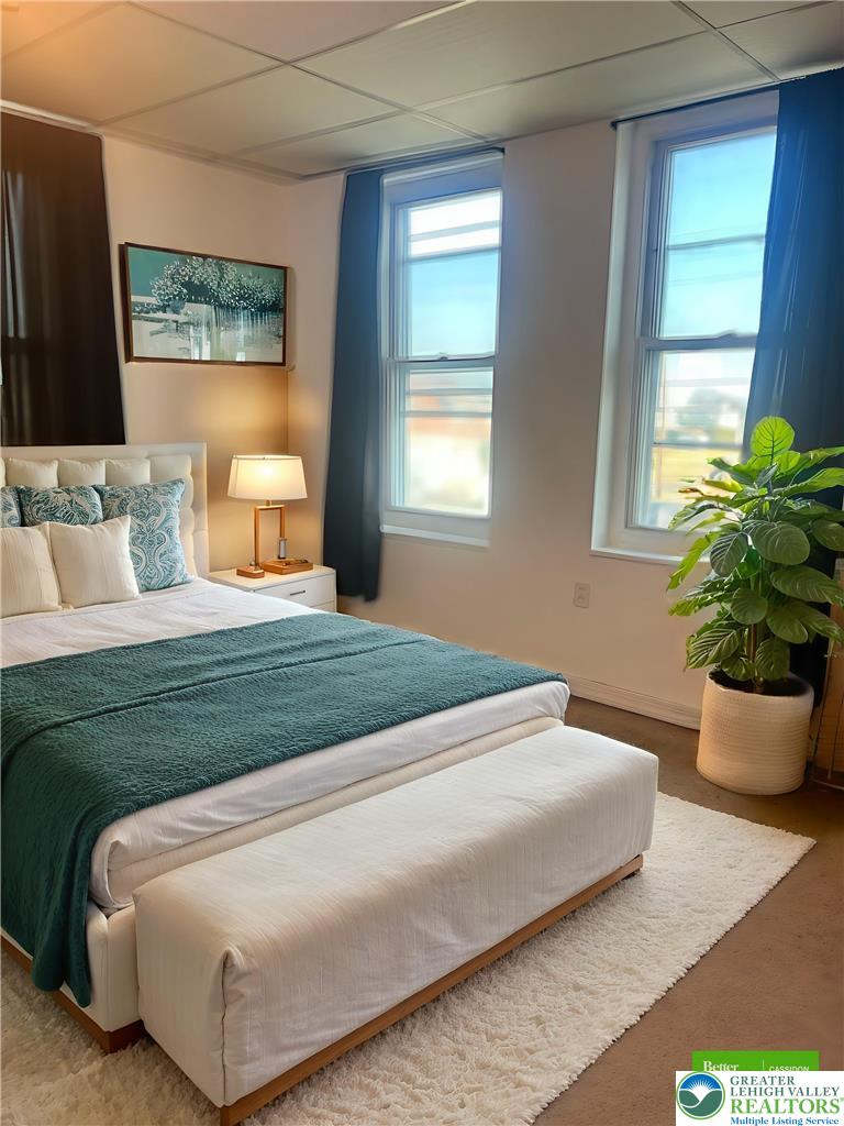 816 North Shell Street Allentown, PA 18109 - Photo 16 of 22 a bedroom with a bed potted plant and window