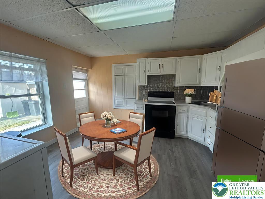 816 North Shell Street Allentown, PA 18109 - Photo 7 of 22 a kitchen with stainless steel appliances kitchen island granite countertop a dining table chairs and a refrigerator