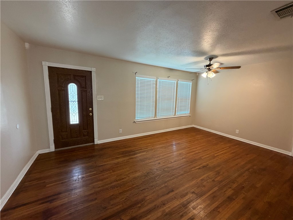 1837 Horne Road Corpus Christi, TX 78416 - Photo 4 of 15 a view of an empty room with glass door and wooden floor