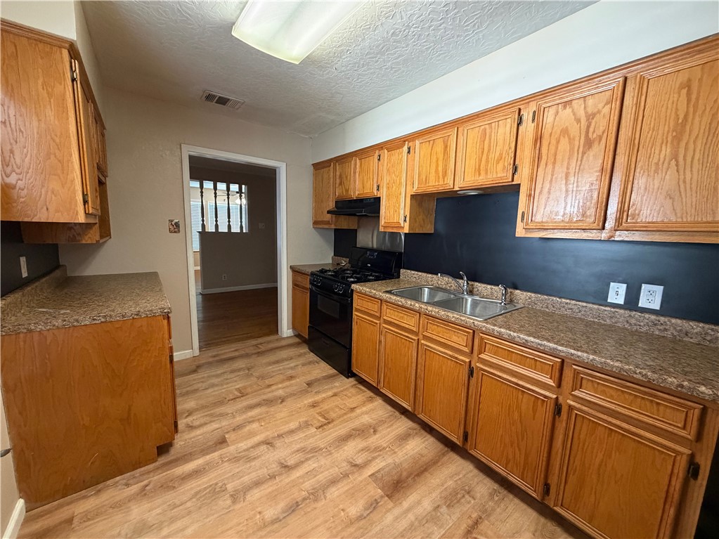 1837 Horne Road Corpus Christi, TX 78416 - Photo 6 of 15 a kitchen with stainless steel appliances granite countertop a refrigerator sink and cabinets