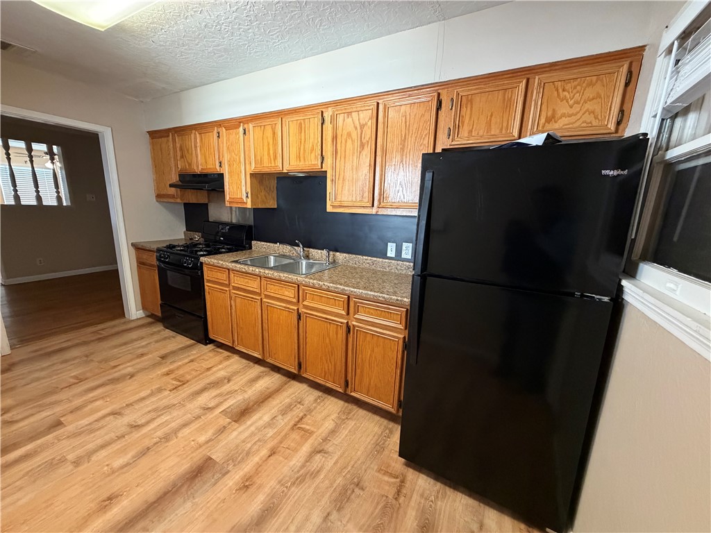 1837 Horne Road Corpus Christi, TX 78416 - Photo 8 of 15 a kitchen with a refrigerator and a stove