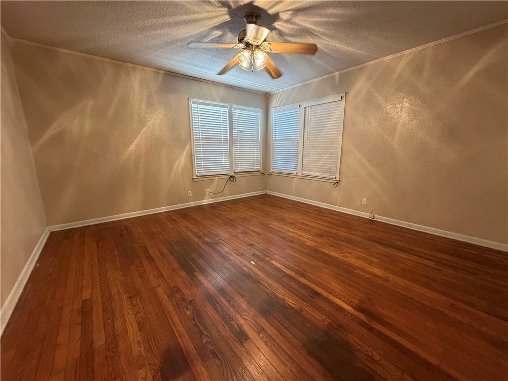 1837 Horne Road Corpus Christi, TX 78416 - Photo 9 of 15 a view of an empty room with window and wooden floor