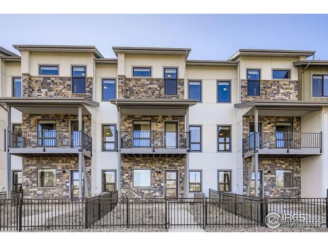 a view of a brick building with many windows