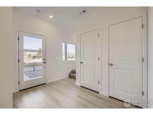 a view of an empty room and closet area