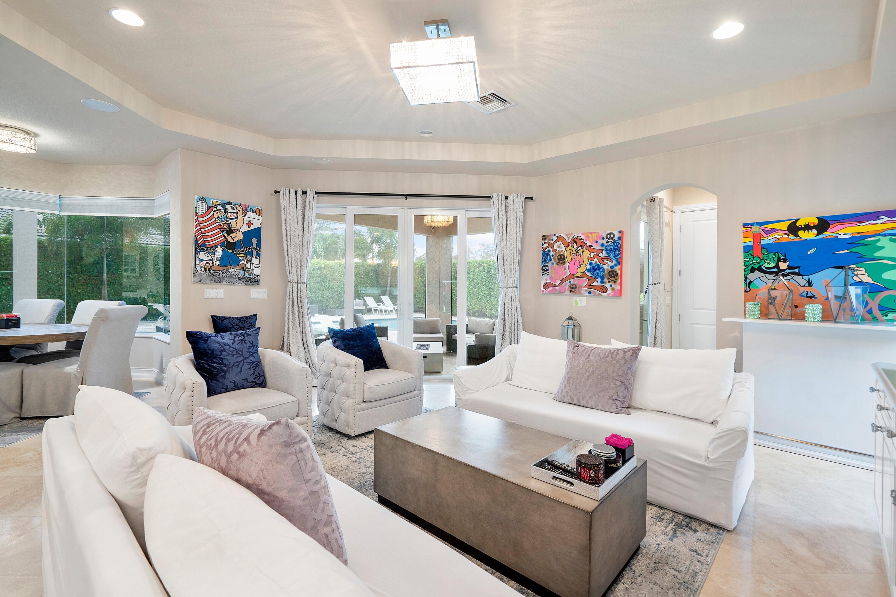 141 Sonata Drive Jupiter, FL 33478 - Photo 20 of 56 Family Room Open to Kitchen and Lanai