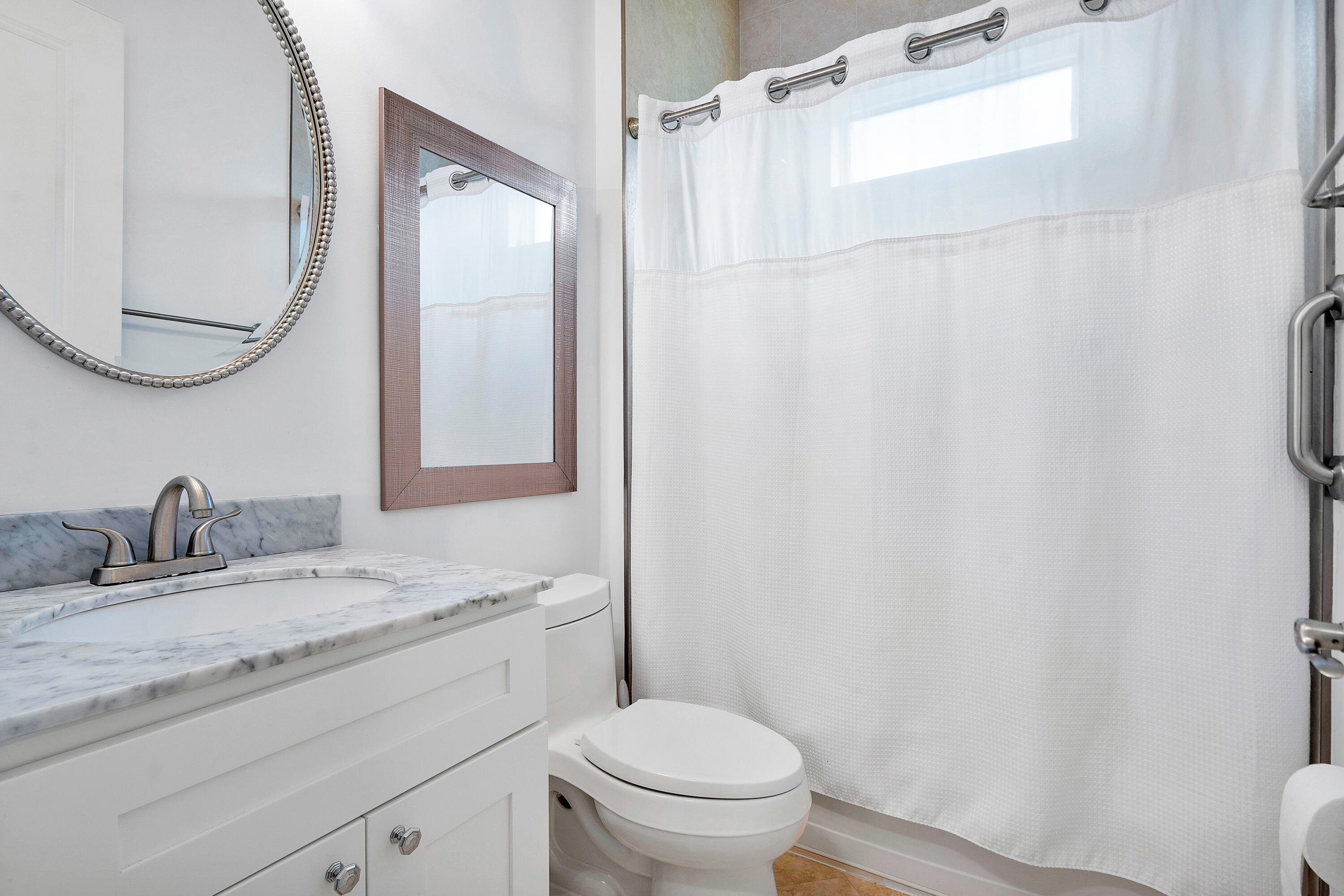 141 Sonata Drive Jupiter, FL 33478 - Photo 26 of 56 Main Level Full Bathroom Ensuite