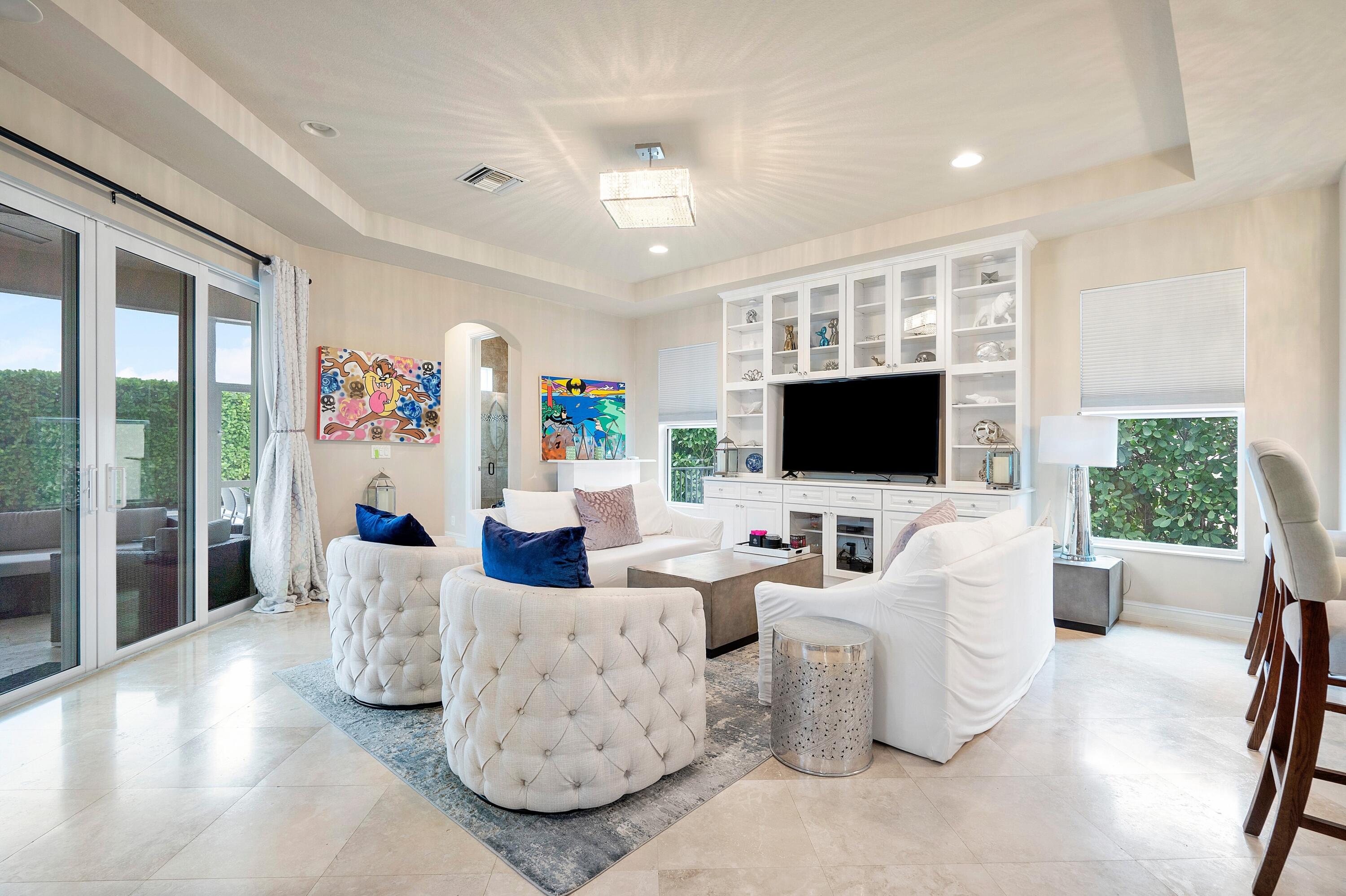 141 Sonata Drive Jupiter, FL 33478 - Photo 8 of 56 Family Room Opens to Lanai