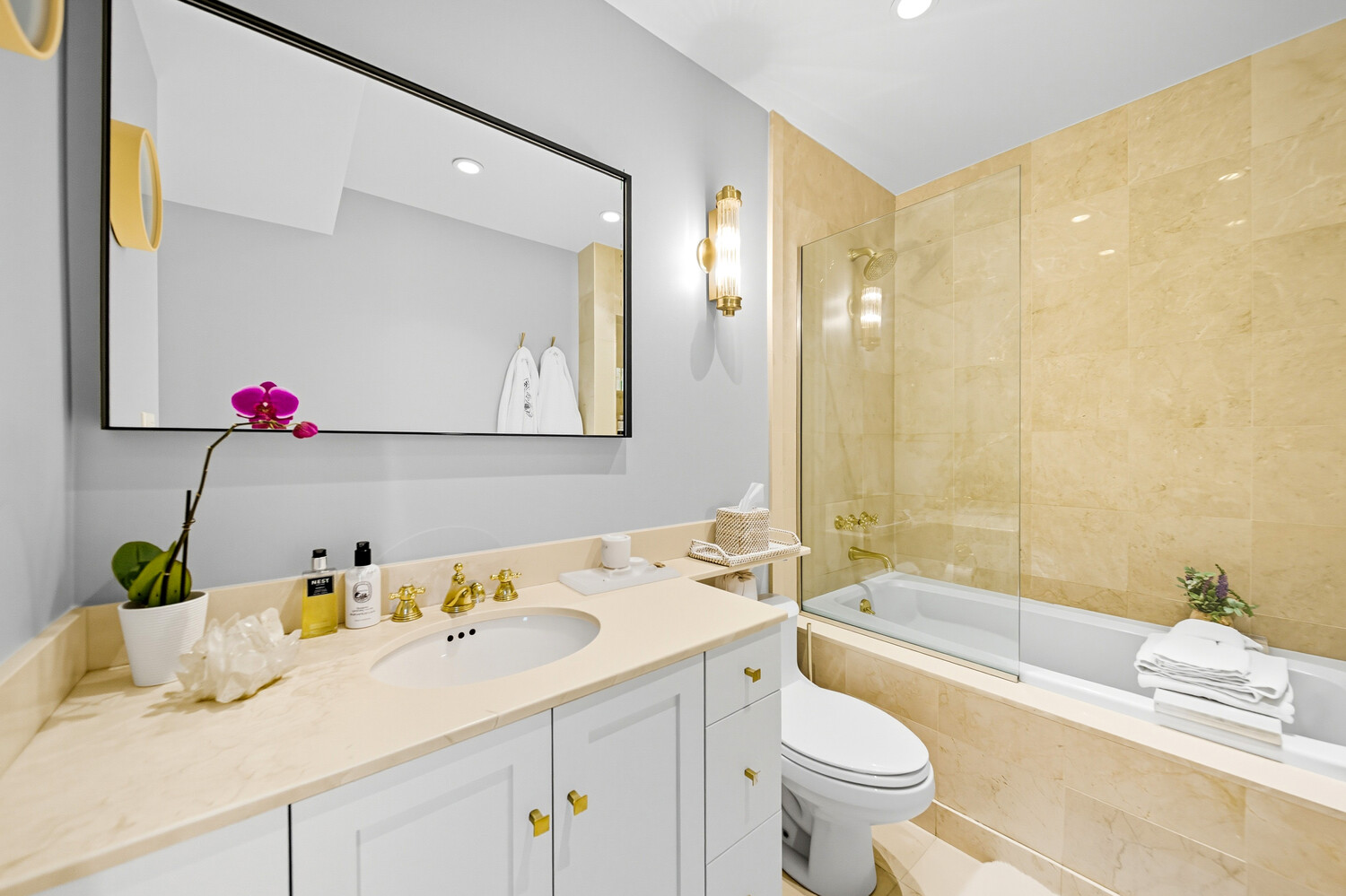 240 Centre Street, Unit 3J Manhattan, NY 10013 - Photo 11 of 15 a bathroom with a sink a toilet and shower