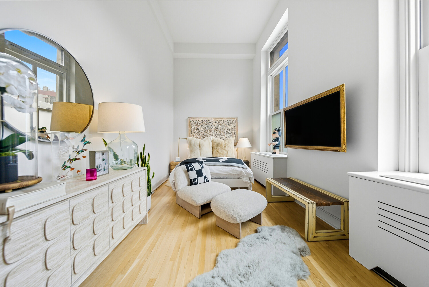 240 Centre Street, Unit 3J Manhattan, NY 10013 - Photo 13 of 15 a living room with furniture and a flat screen tv