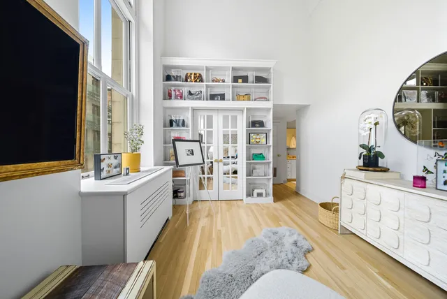 a living room with furniture fireplace and flat screen tv