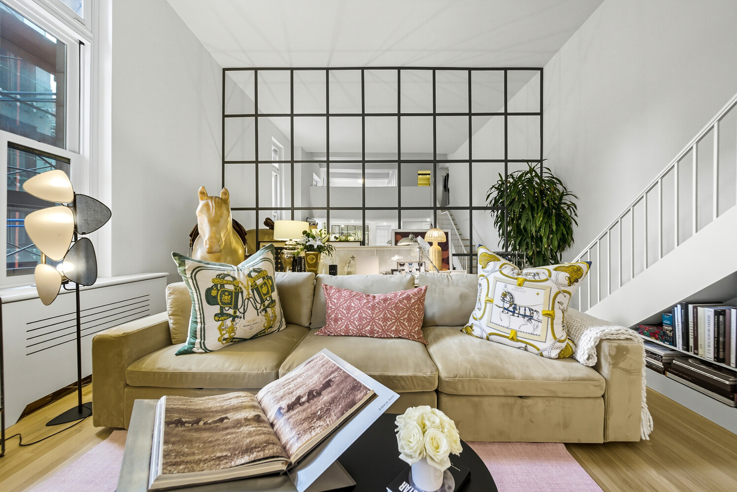 240 Centre Street, Unit 3J Manhattan, NY 10013 - Photo 2 of 15 a living room with furniture and a potted plant