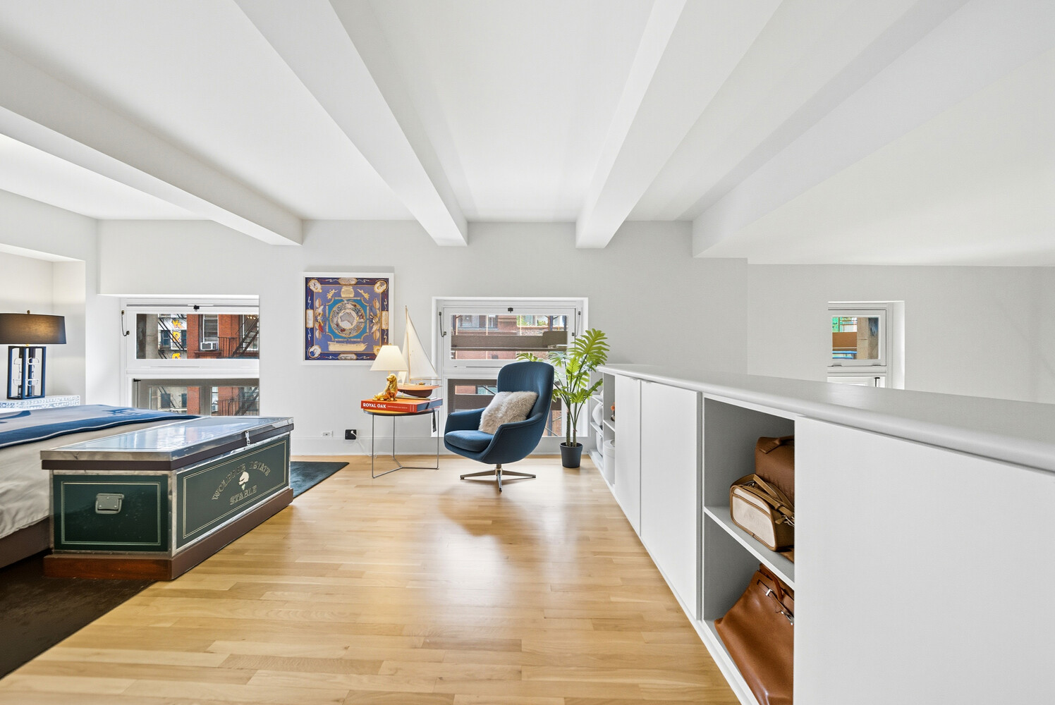 240 Centre Street, Unit 3J Manhattan, NY 10013 - Photo 7 of 15 a living room with furniture and a wooden floor
