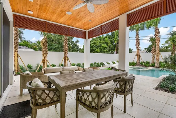 a view of an outdoor space with a table and chairs