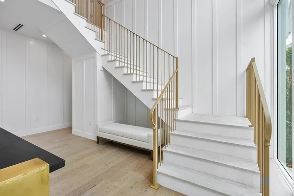 a view of entryway and hall with wooden floor