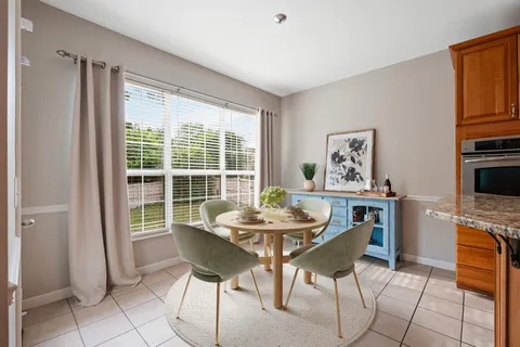 a spacious bathroom with a bathtub and a sink