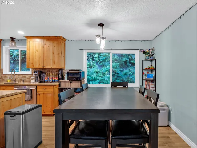 a view of a livingroom with furniture window and wooden floor