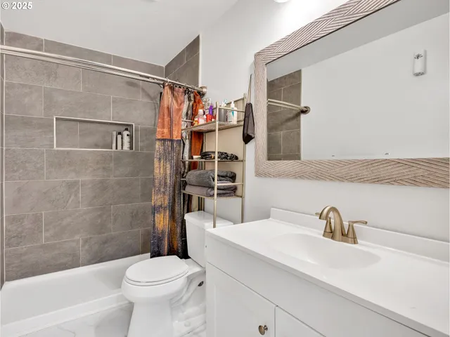 a bedroom with a bed and a dresser in it