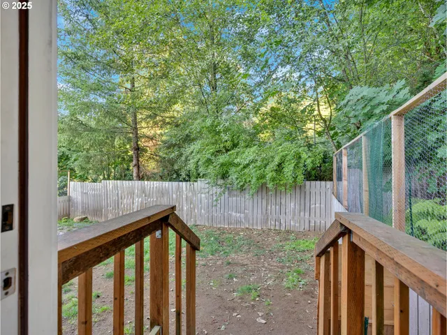 a pathway of a house with a yard