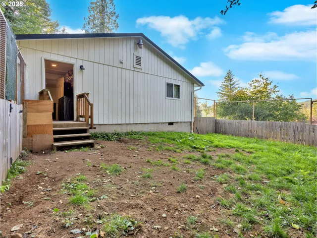 a backyard of a house with lots of green space