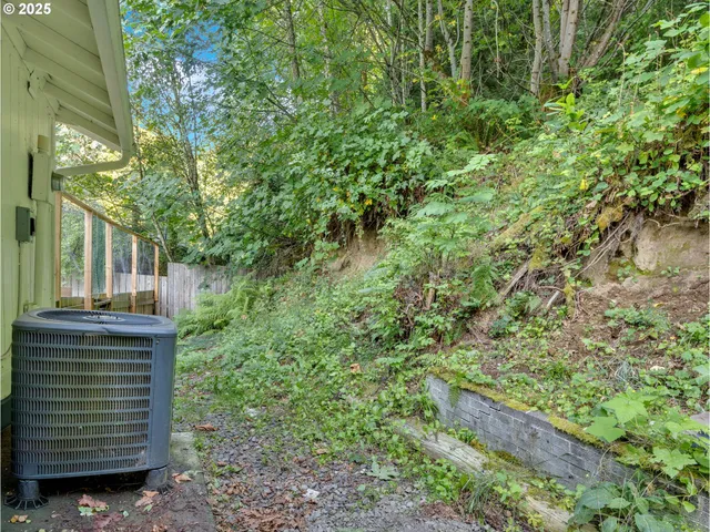 a backyard of a house with a yard and outdoor seating