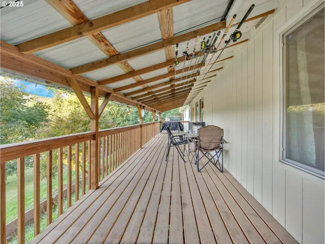 a view of balcony with wooden floor