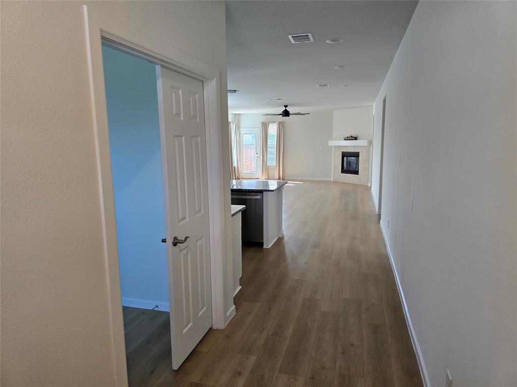 508 Williams Way Van Alstyne, TX 75495 - Photo 3 of 26 a view of a hallway with wooden floor and staircase
