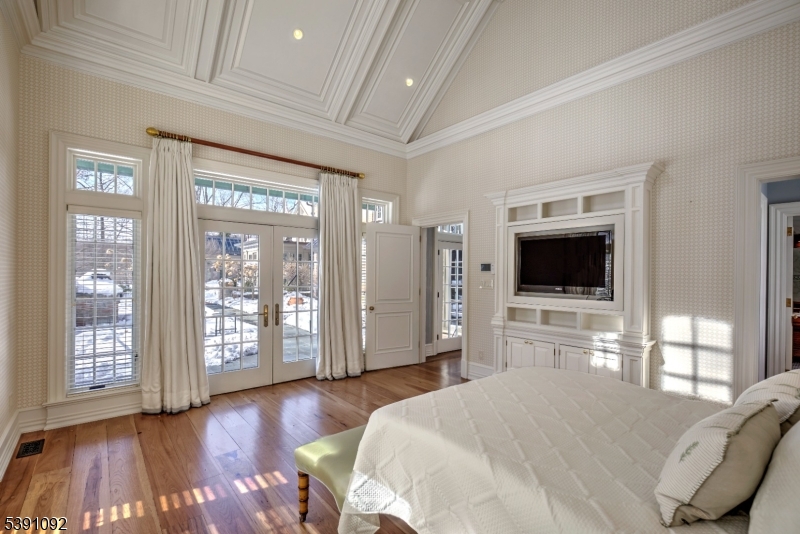 156 Overleigh Road Bernardsville, NJ 07924 - Photo 17 of 39 a bedroom with a bed and wooden floor