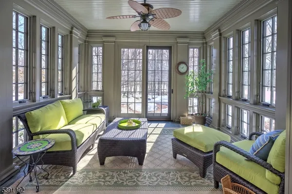 a view of a hallway with living room and furniture