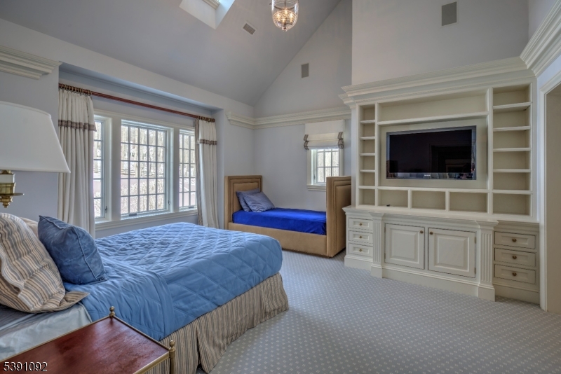 156 Overleigh Road Bernardsville, NJ 07924 - Photo 28 of 48 a bedroom with furniture and flat screen tv