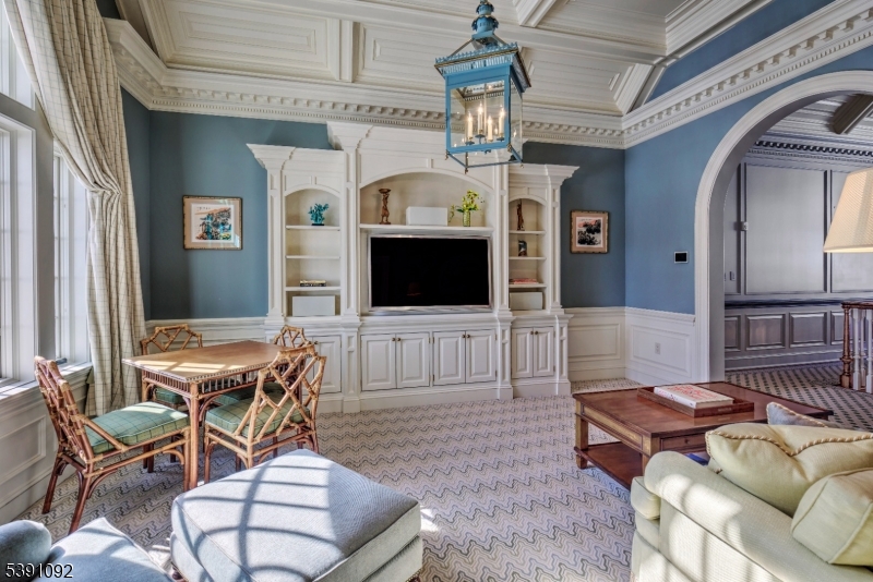 156 Overleigh Road Bernardsville, NJ 07924 - Photo 31 of 48 a living room with furniture a flat screen tv and kitchen view