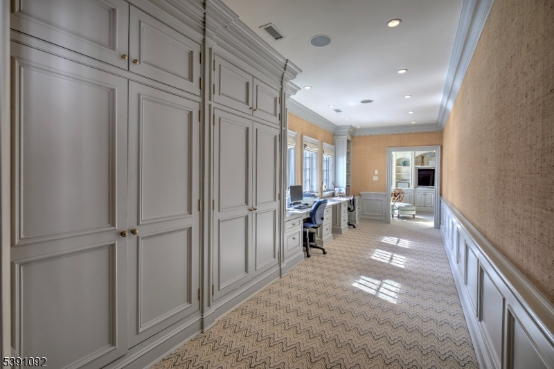 156 Overleigh Road Bernardsville, NJ 07924 - Photo 32 of 48 a view of a hallway with living room and furniture