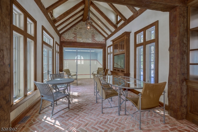156 Overleigh Road Bernardsville, NJ 07924 - Photo 32 of 39 a view of a patio with couple of chairs and a barbeque