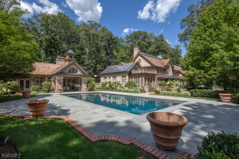 156 Overleigh Road Bernardsville, NJ 07924 - Photo 44 of 48 a front view of house with yard and outdoor seating