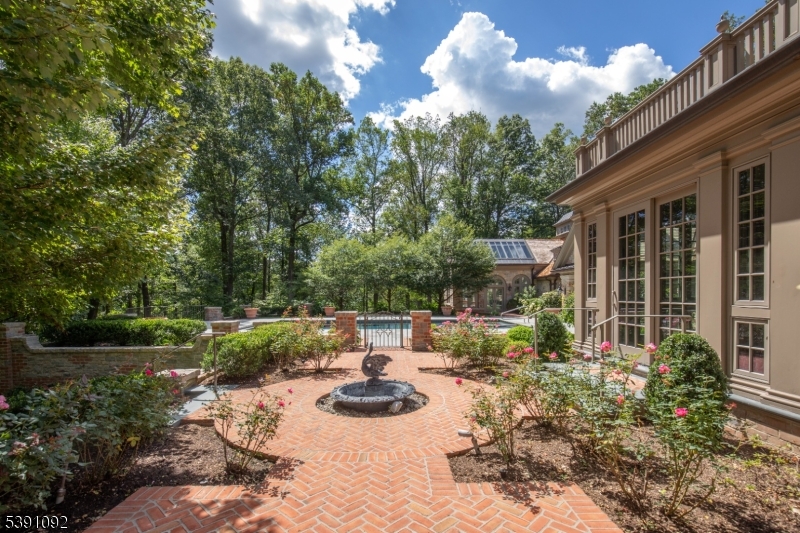 156 Overleigh Road Bernardsville, NJ 07924 - Photo 46 of 48 a view of backyard with table and chairs and potted plants