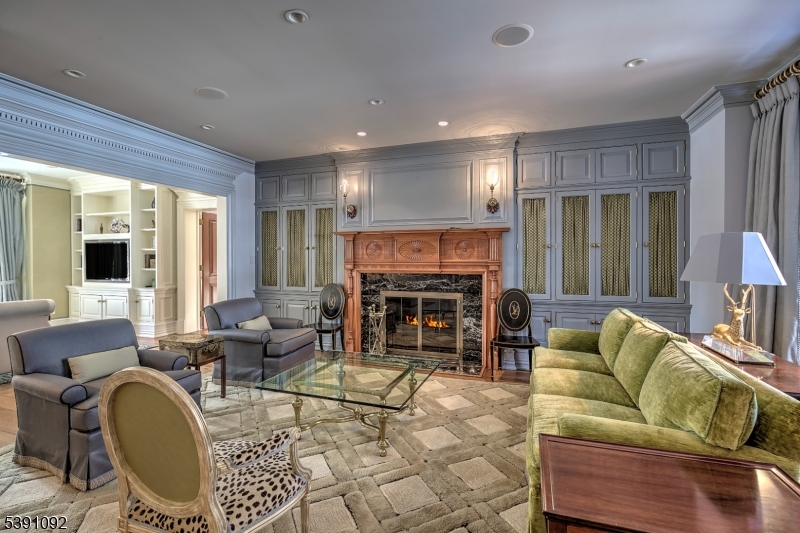 156 Overleigh Road Bernardsville, NJ 07924 - Photo 6 of 48 a living room with fireplace furniture and a large window