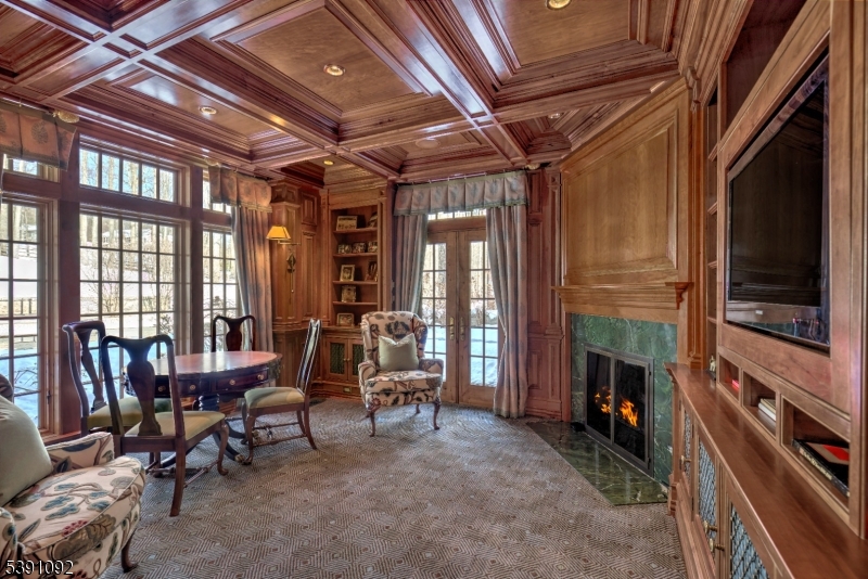 156 Overleigh Road Bernardsville, NJ 07924 - Photo 7 of 48 a living room with furniture a flat screen tv and a fireplace